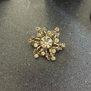 Sliver and rhinestone snowflake brooch